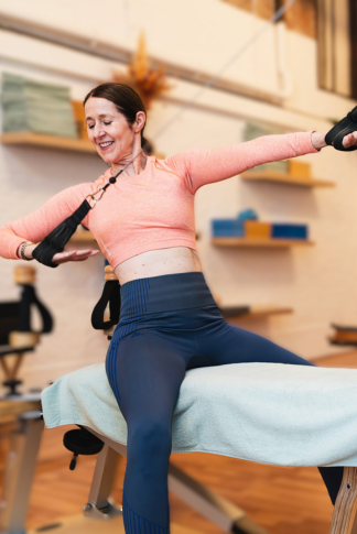 A woman is engaged in the GYROTONIC training method