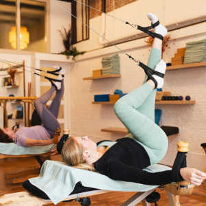 Two women use the GYROTONIC training method