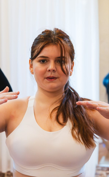 Woman holds a pose during pilates.