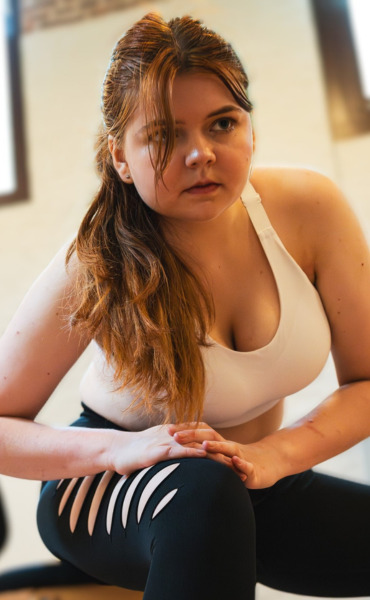 Woman holds a pose during GYROKINESIS.